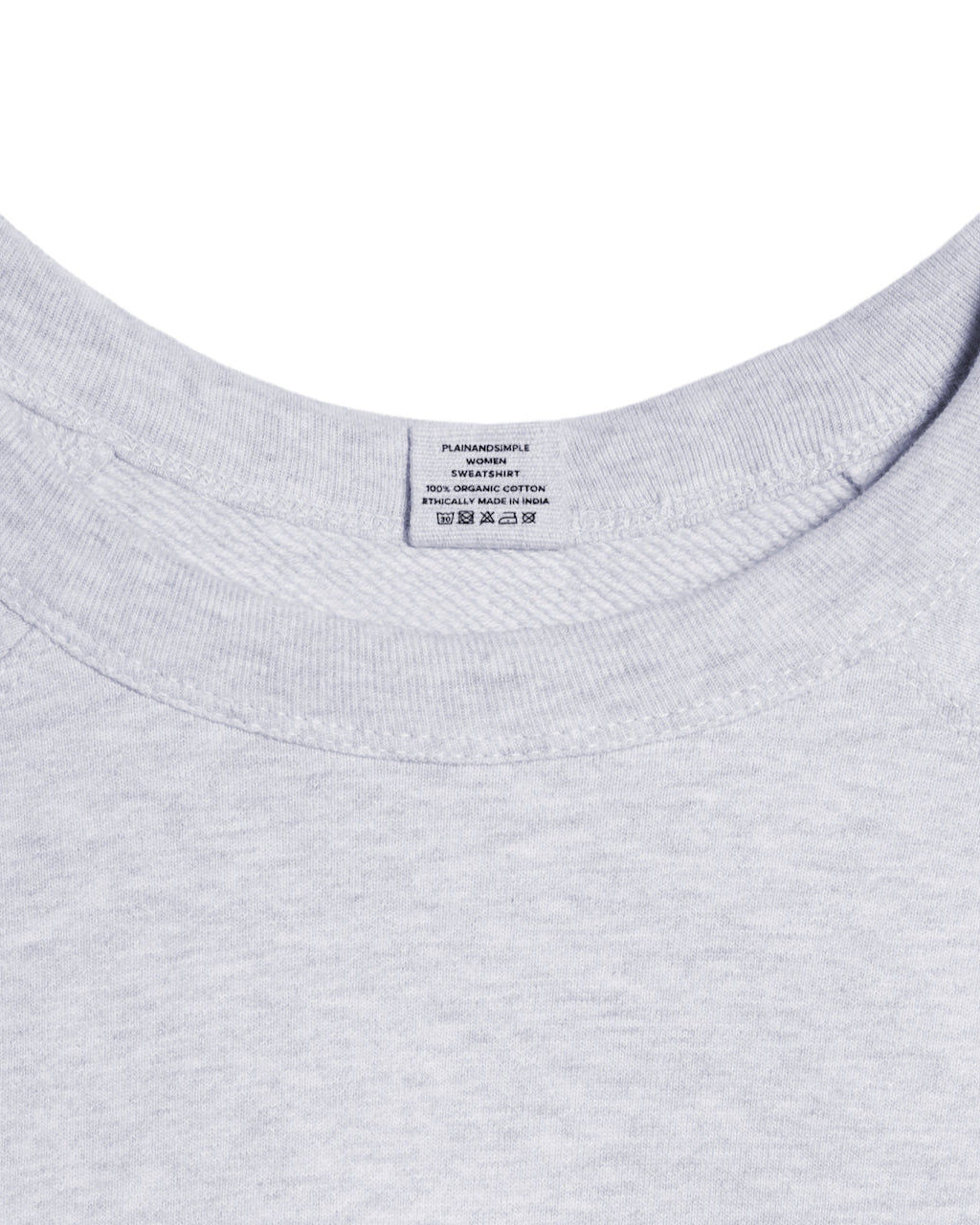 A close up of a neck label in a women's grey heavyweight organic cotton sweatshirt.
