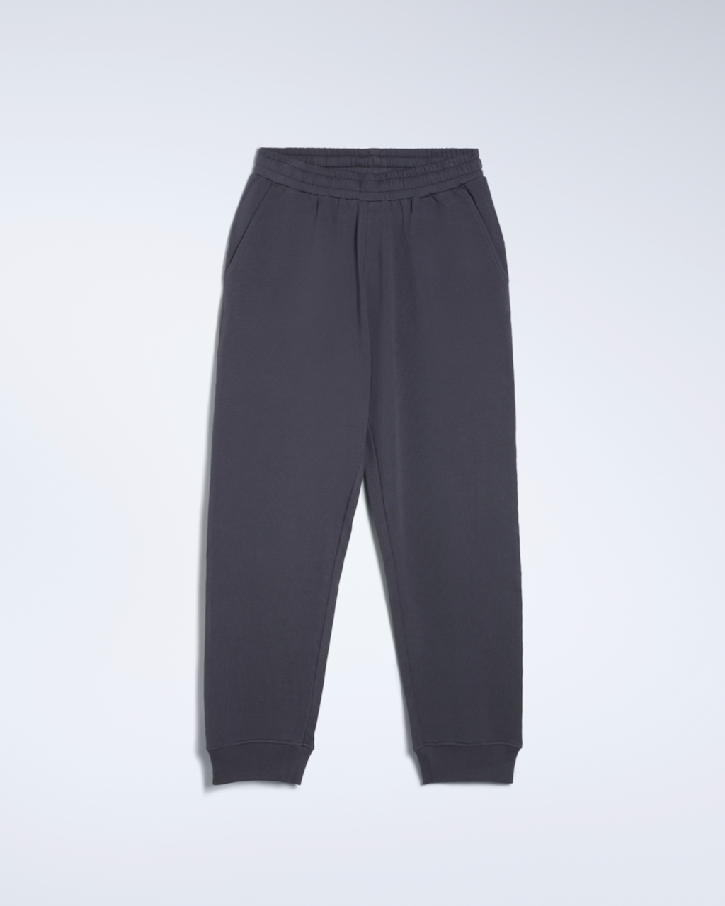A flatlay of a pair of dark grey, organic cotton joggers.