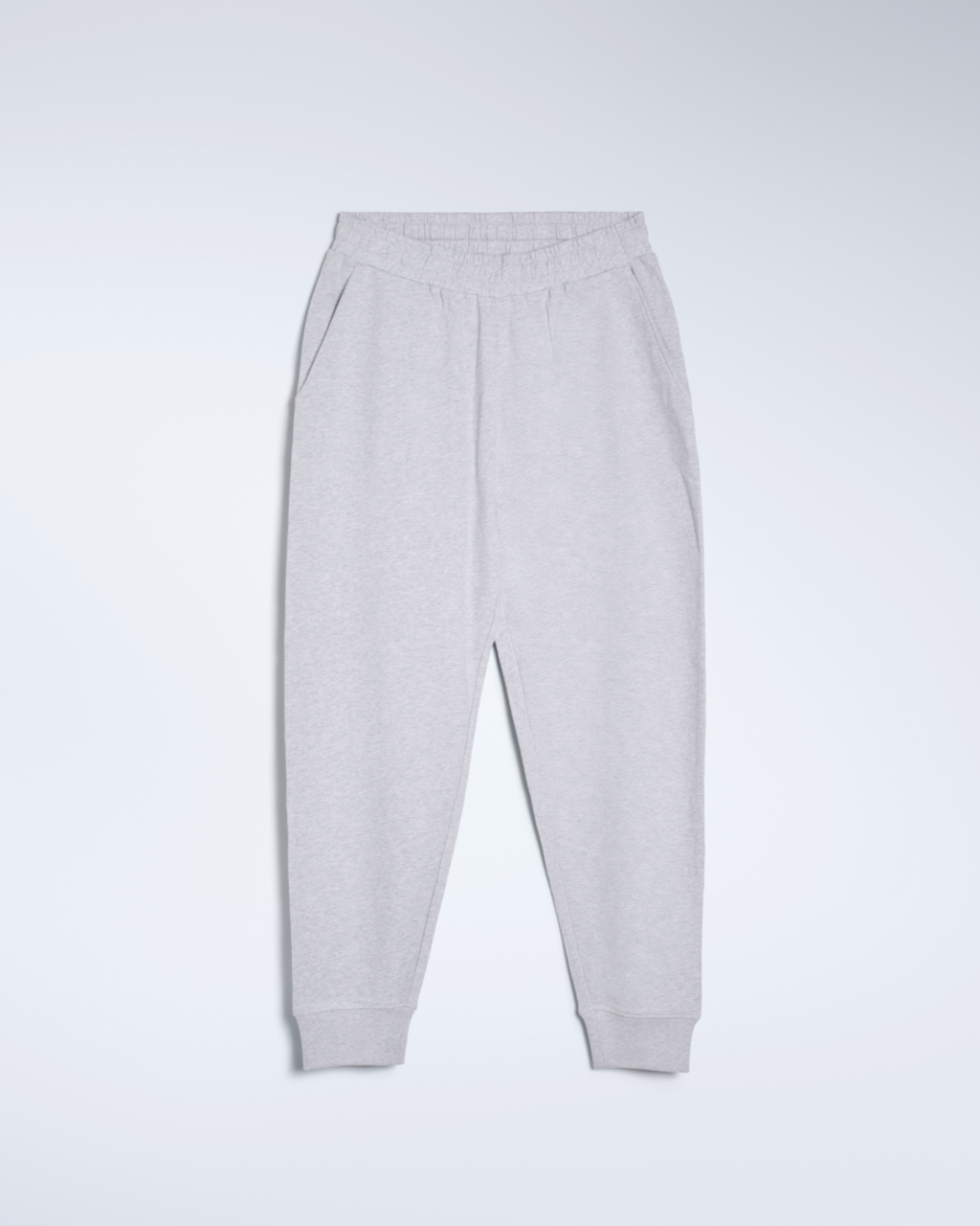 A flatlay of a pair of grey, organic cotton joggers.