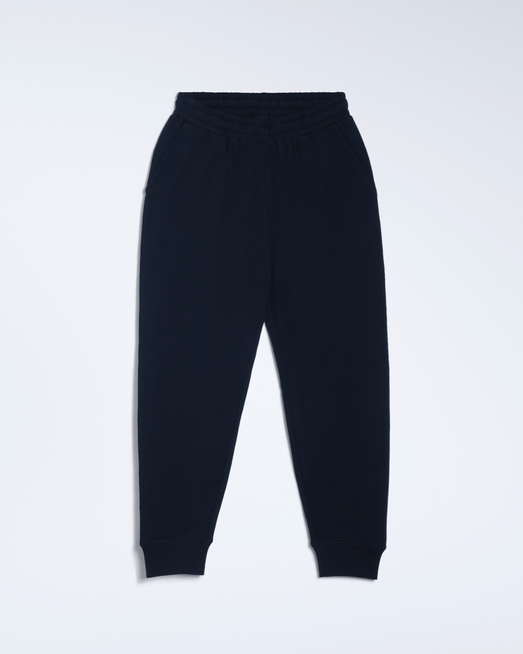 A flatlay of a pair of navy, organic cotton joggers.