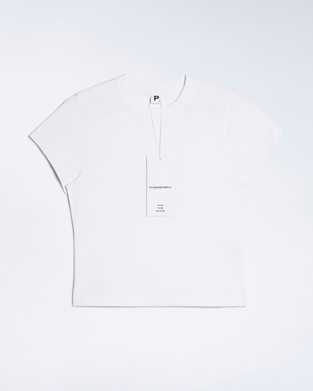 A flatlay of a white, organic cotton mini t shirt.