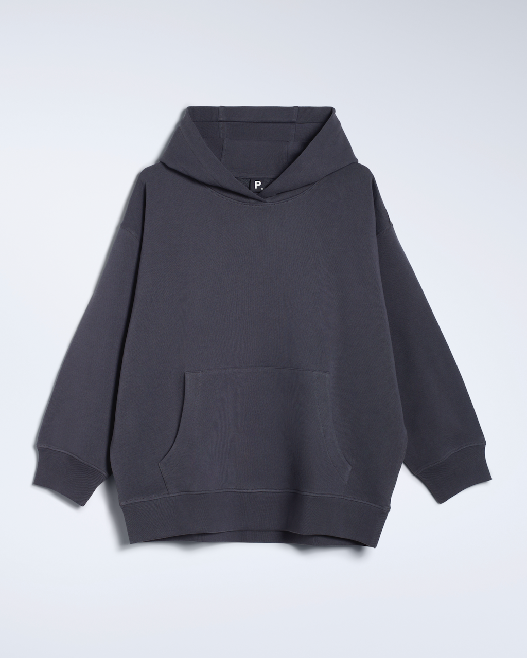 A flatlay of a dark grey, oversized, organic cotton hoodie.
