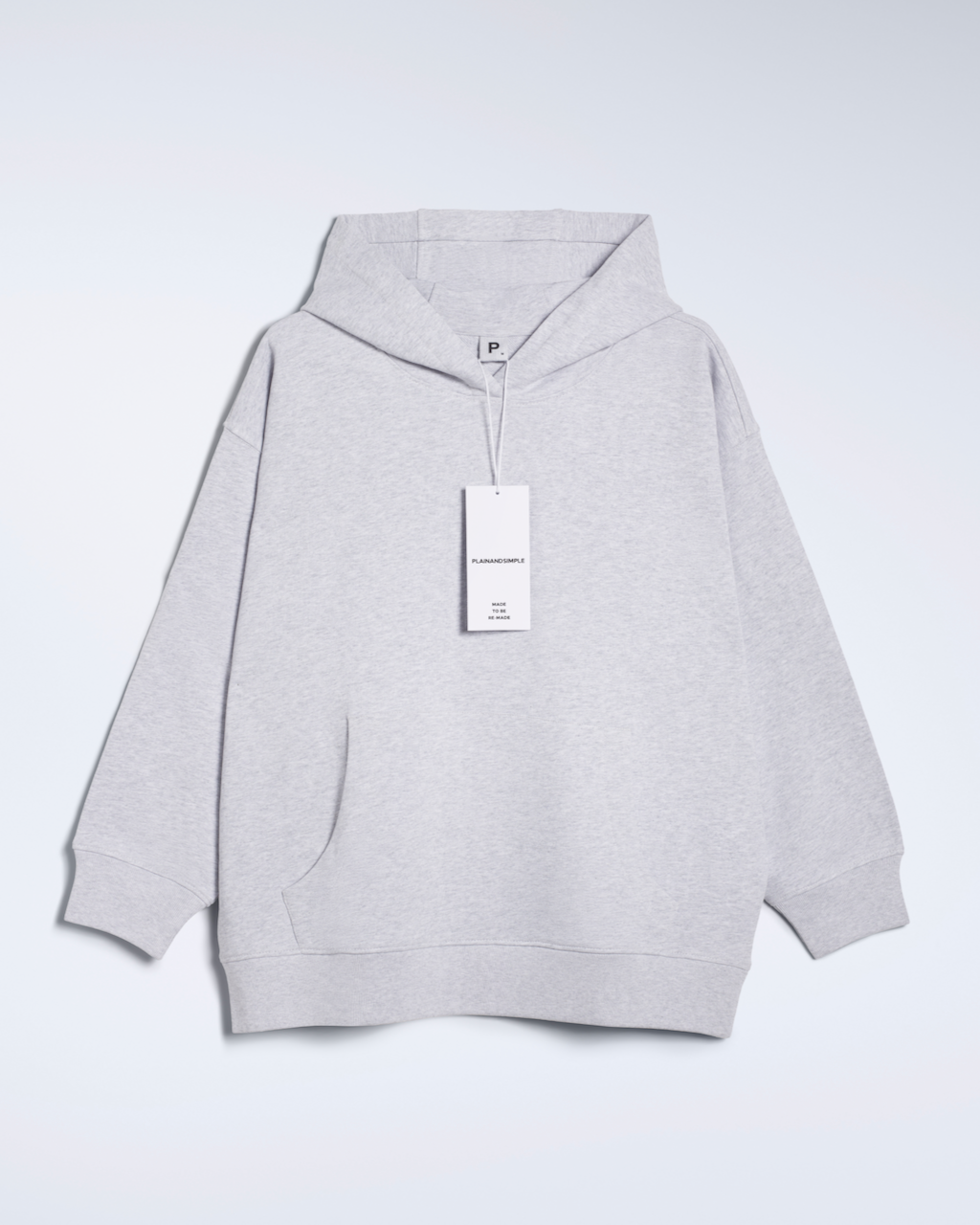 A flatlay of a grey, oversized, organic cotton hoodie.