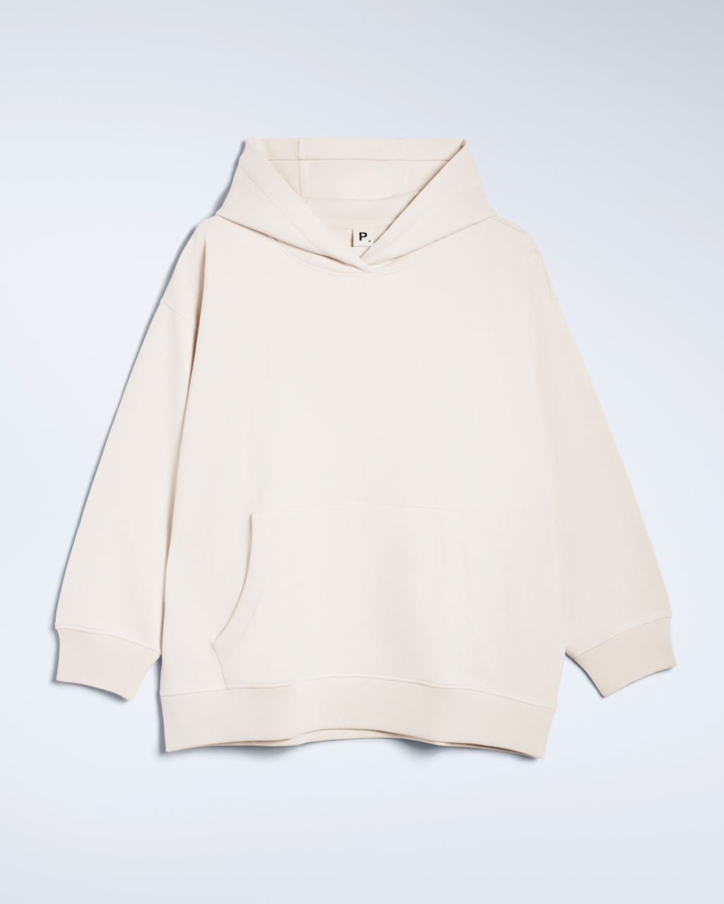 A flatlay of a natural coloured, oversized, organic cotton hoodie.