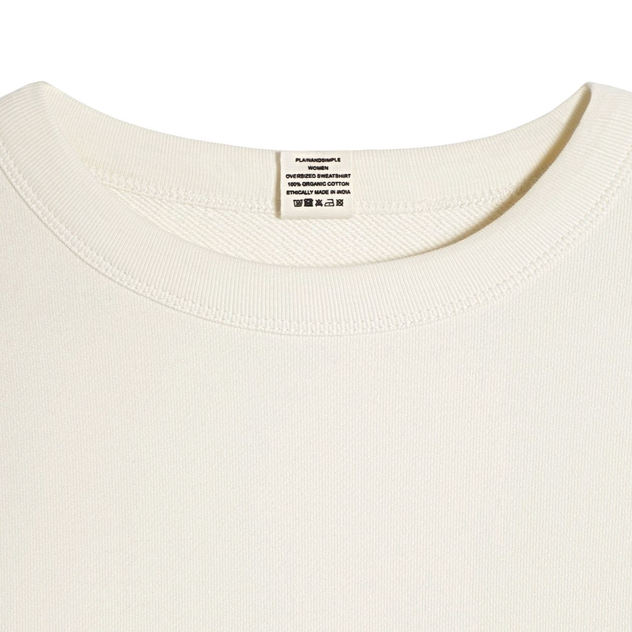 A close up of an neck label in a women's ecru oversized organic cotton sweatshirt.