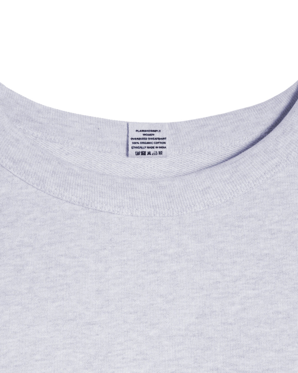 A close up of an neck label in a women's grey oversized organic cotton sweatshirt.