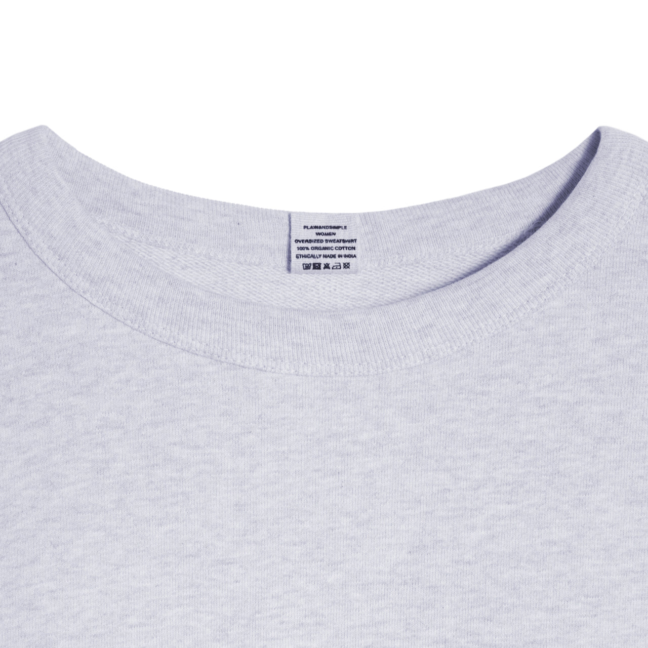 A close up of an neck label in a women's grey oversized organic cotton sweatshirt.