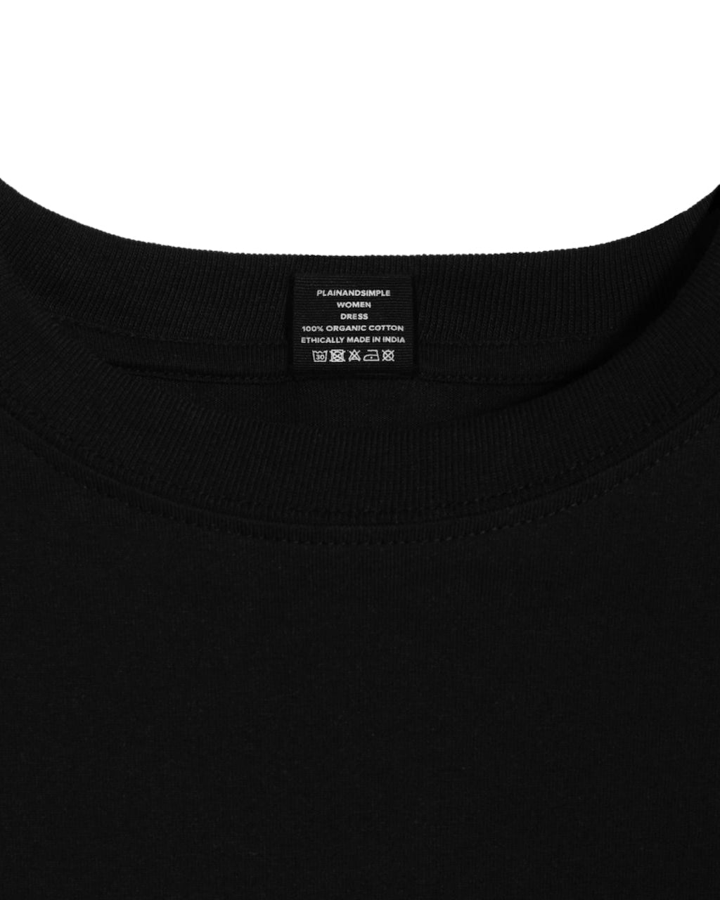 A close up of an neck label in a women's black organic cotton t shirt dress.