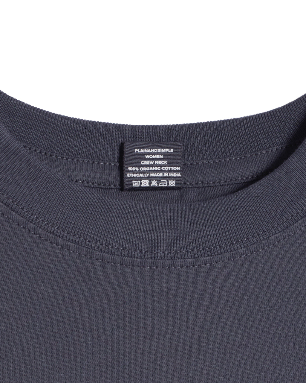 A close up of a neck label in a women's dark grey short sleeve crew neck organic cotton t shirt.
