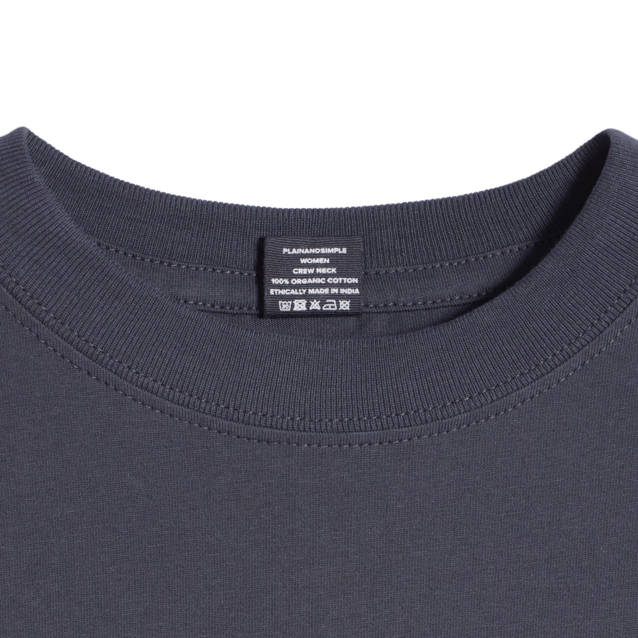 A close up of a neck label in a women's dark grey short sleeve crew neck organic cotton t shirt.