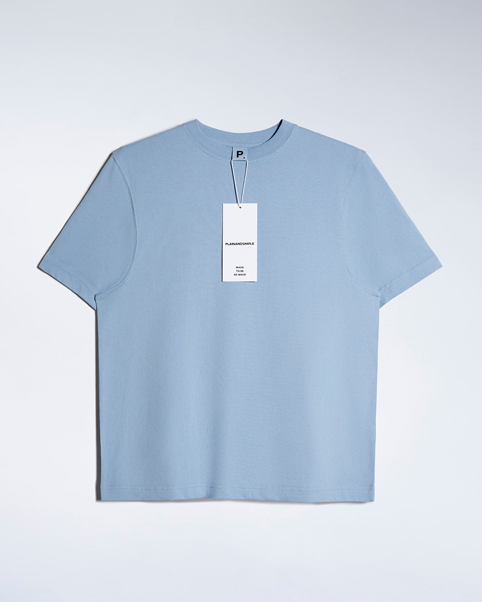 A flatlay of a women's plain blue short sleeve crew neck organic cotton t shirt.