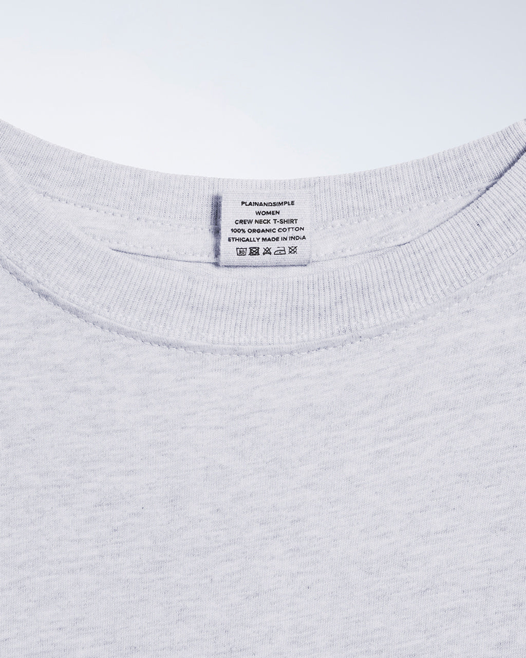 A close up of an neck label in a women's grey short sleeve crew neck organic cotton t shirt.