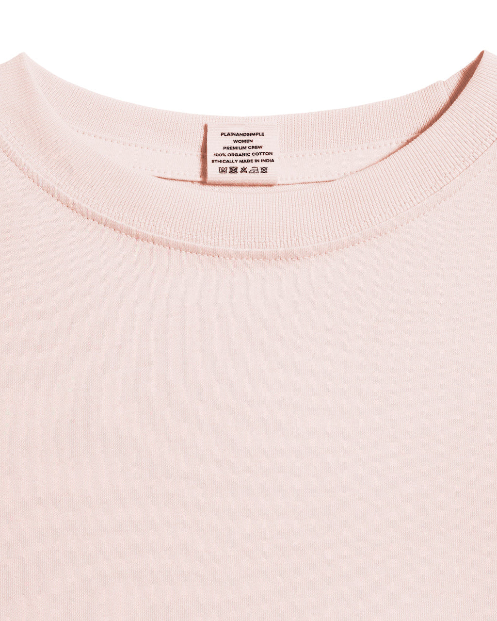A close up of an neck label in a women's pink short sleeve crew neck organic cotton t shirt.