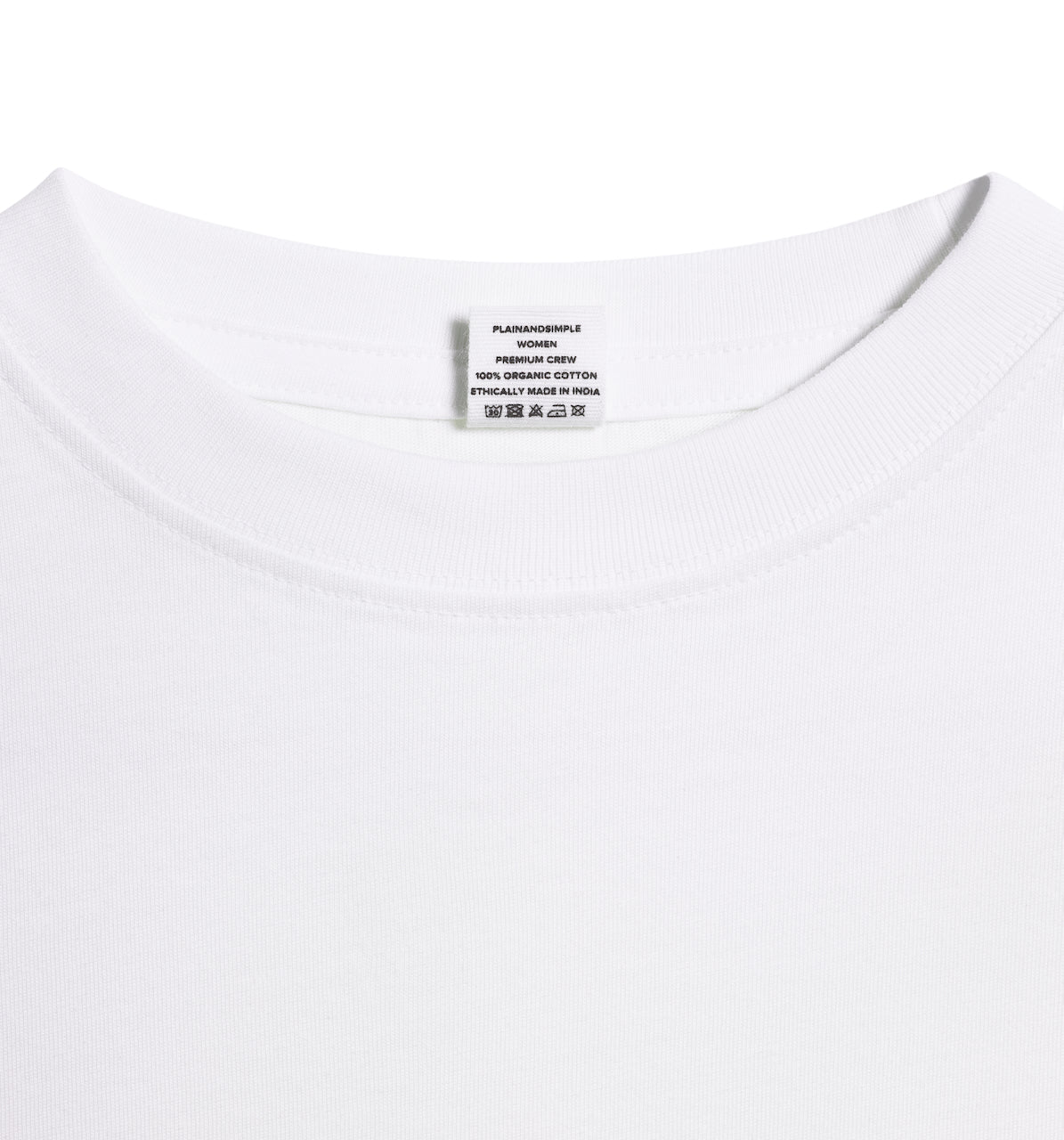 A close up of an neck label in a women's white short sleeve crew neck organic cotton t shirt.