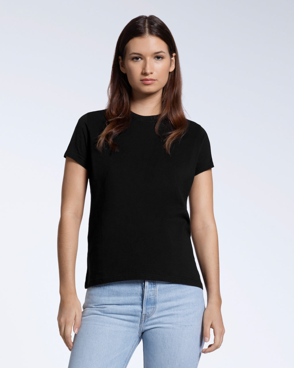 A woman facing front on looking into the camera, modelling a plain black short sleeve organic cotton t shirt.
