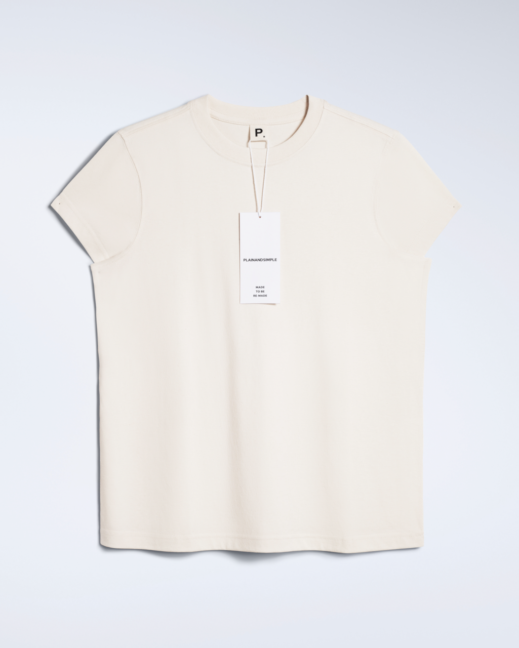 A flatlay of a natural coloured, crew neck, organic cotton t shirt.