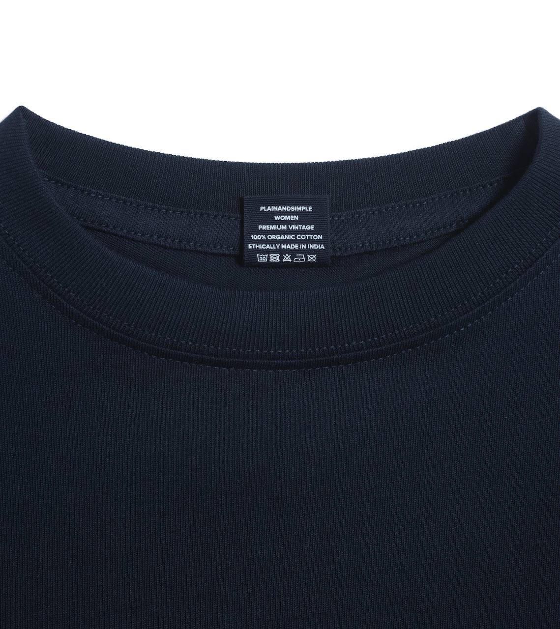 A close up of an neck label in a women's navy short sleeve crew neck organic cotton t shirt.