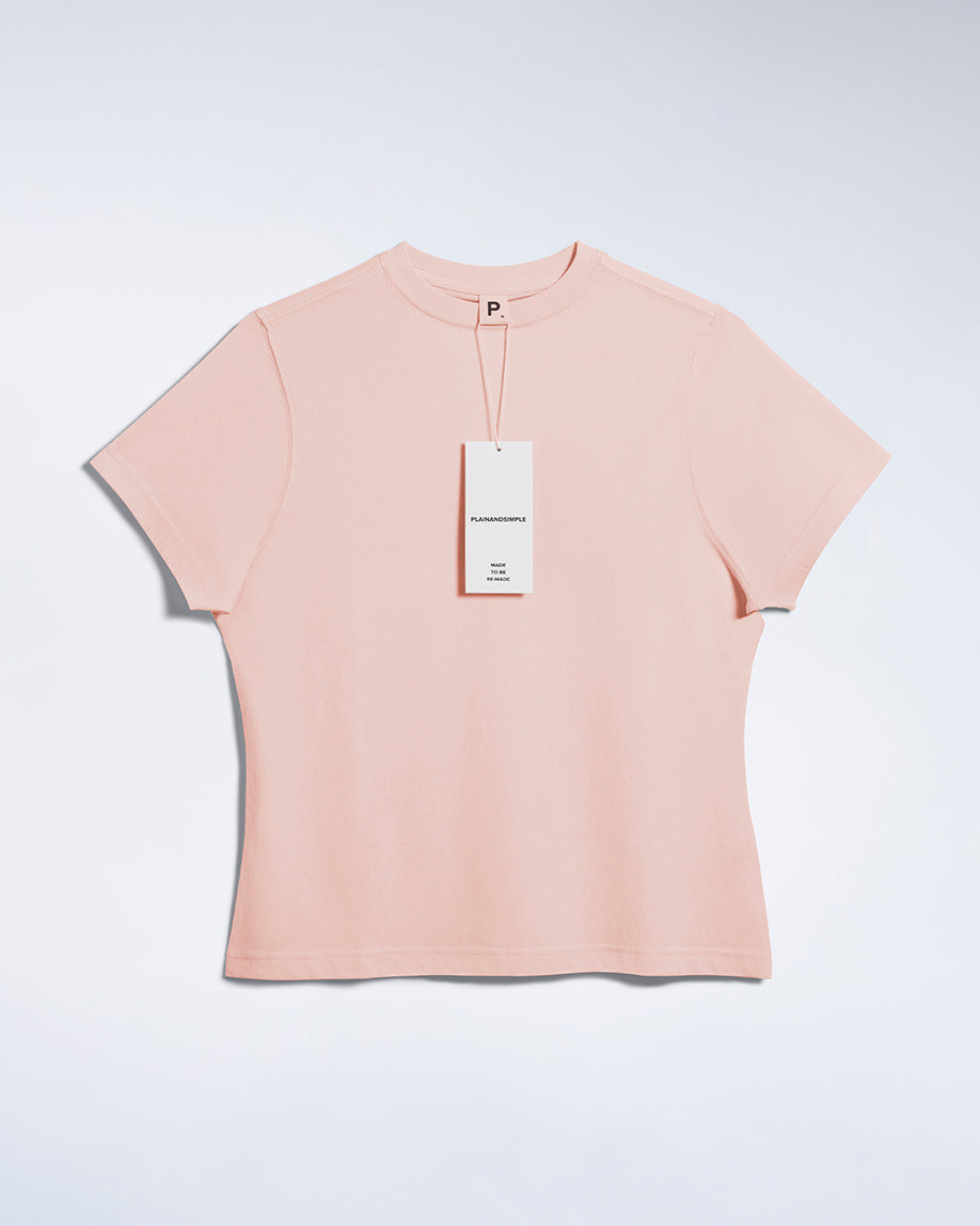 A flatlay of a women's plain pink short sleeve crew neck organic cotton t shirt.