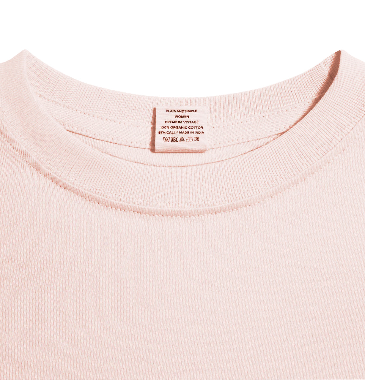 A close up of an neck label in a women's pink short sleeve crew neck organic cotton t shirt.
