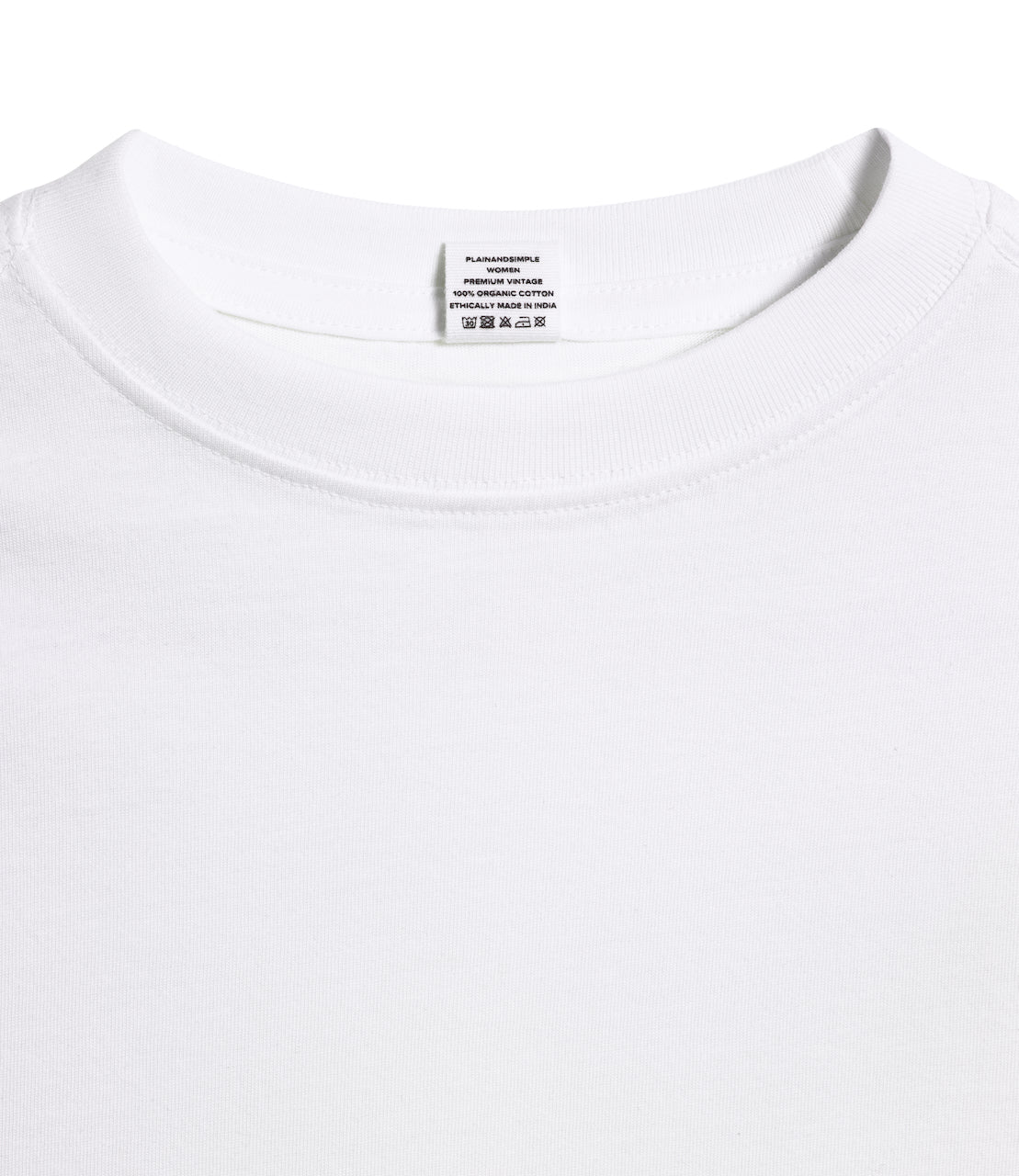 A close up of an neck label in a women's white short sleeve crew neck organic cotton t shirt.