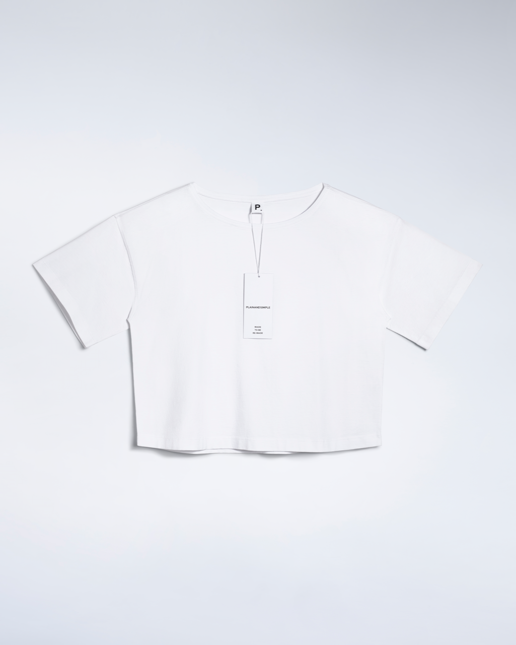 A flatlay of a white, wide neck, organic cotton t shirt.