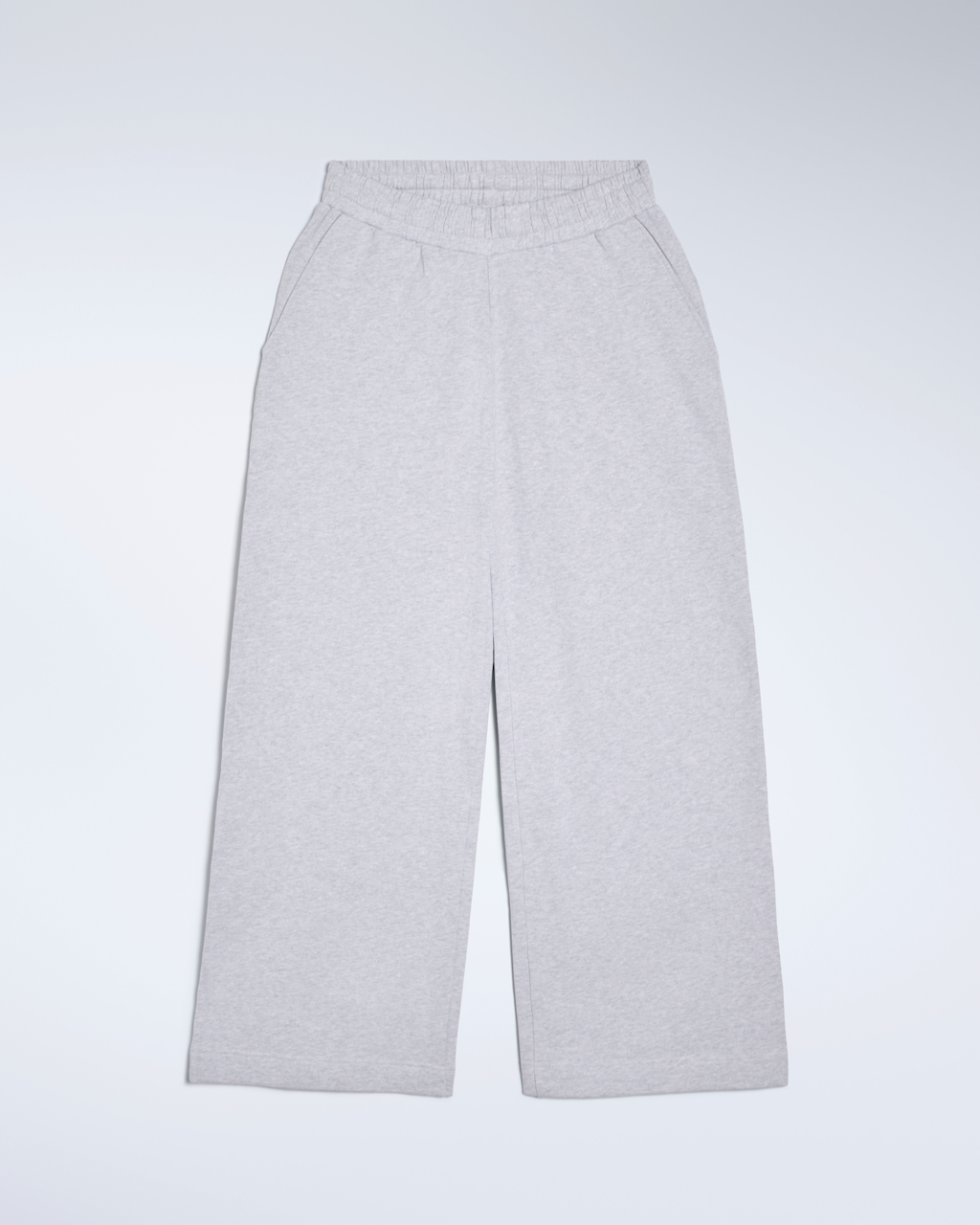 A flatlay of a pair of grey, wide leg, organic cotton joggers.